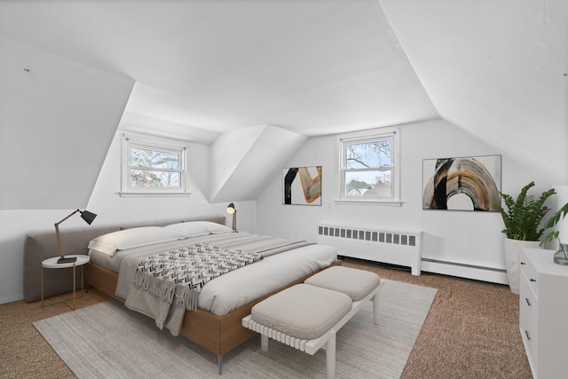 bedroom with a baseboard heating unit, vaulted ceiling, and radiator