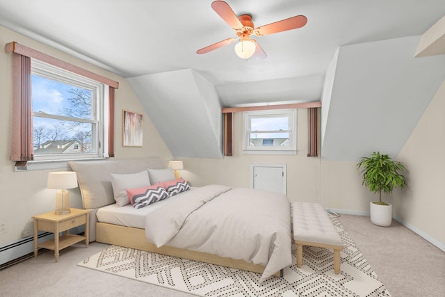 carpeted bedroom with multiple windows, a baseboard heating unit, lofted ceiling, and ceiling fan