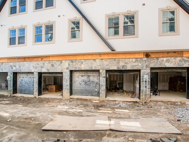 65 W 2nd St Unit 7, Mount Vernon, NY 10550 - exterior space with stucco siding, an attached garage, and stone siding