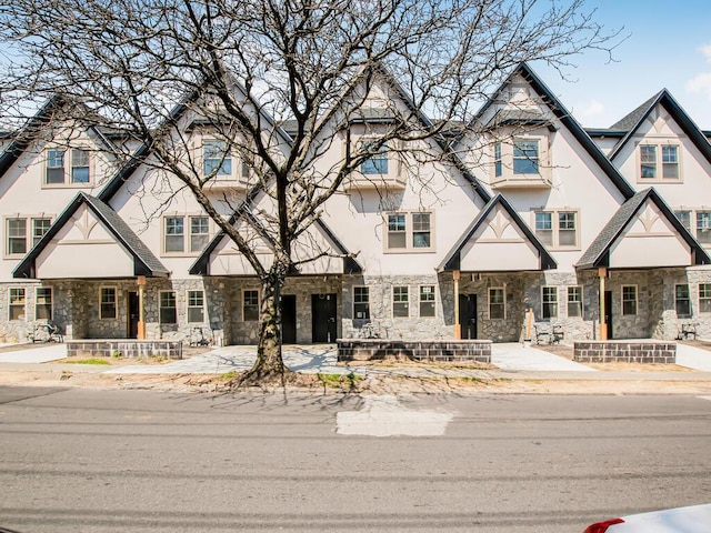 65 W 2nd St Unit 7, Mount Vernon, NY 10550 - view of front of home featuring stucco siding and stone siding