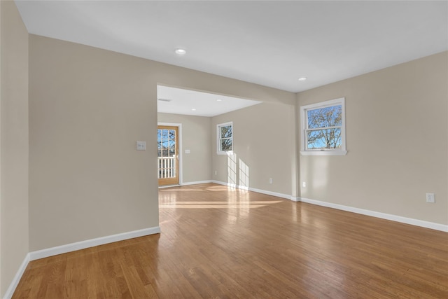 empty room with hardwood / wood-style floors