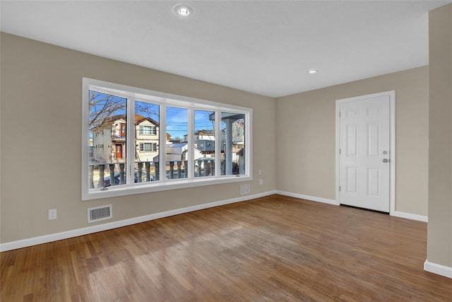 unfurnished room with light hardwood / wood-style floors