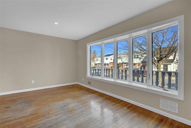 unfurnished room featuring light hardwood / wood-style flooring