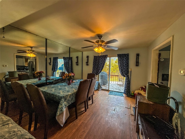 dining space featuring hardwood / wood-style flooring and ceiling fan