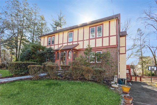 tudor house with a front yard