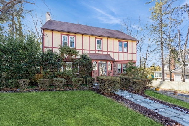 tudor house with a front yard