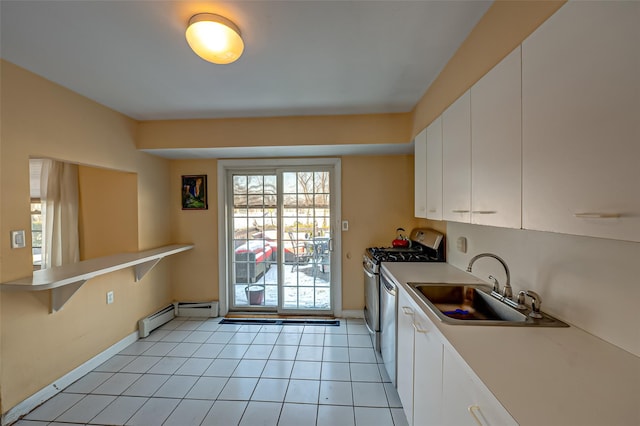 kitchen with light tile patterned floors, a baseboard heating unit, sink, and white cabinets