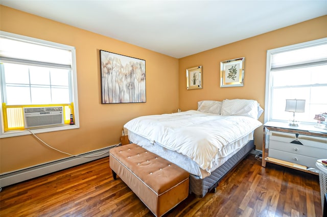 bedroom featuring cooling unit, a baseboard radiator, and dark hardwood / wood-style floors