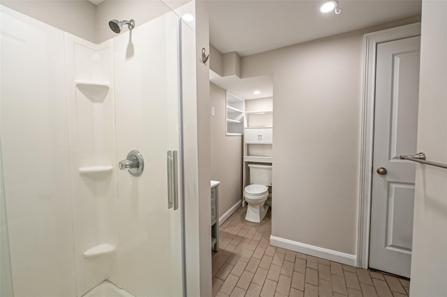 bathroom featuring vanity, toilet, and walk in shower