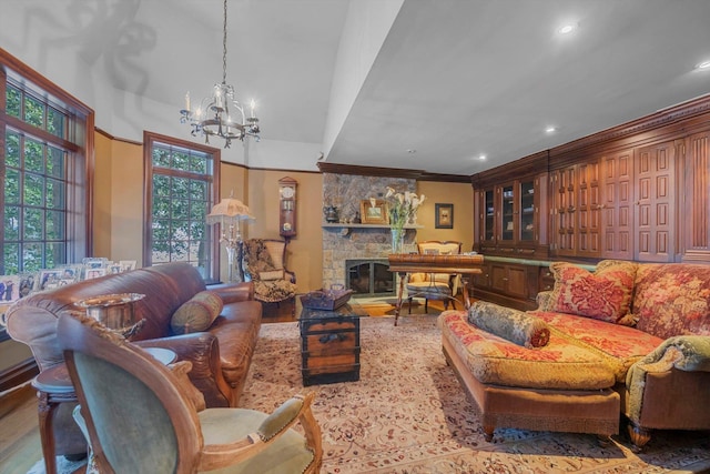 183 Mill Spring Rd, Manhasset, NY 11030 - living area featuring a notable chandelier, recessed lighting, crown molding, wood finished floors, and a fireplace