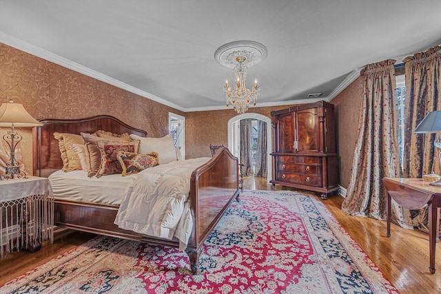 183 Mill Spring Rd, Manhasset, NY 11030 - bedroom with ornamental molding, a notable chandelier, wallpapered walls, and wood finished floors