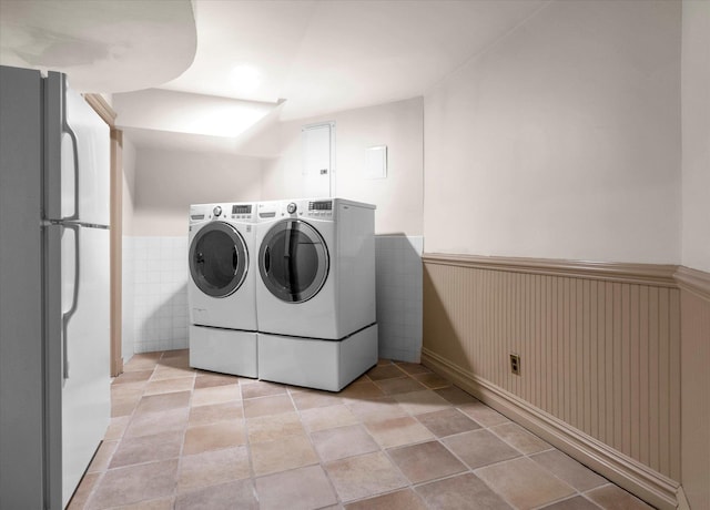 183 Mill Spring Rd, Manhasset, NY 11030 - laundry room featuring wainscoting, washer and clothes dryer, and laundry area