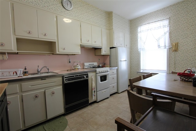 kitchen with white cabinetry, white appliances, sink, and light tile patterned floors