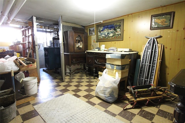 misc room featuring wood walls