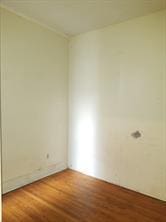 spare room with hardwood / wood-style floors