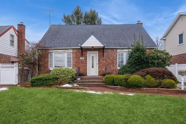 bungalow-style home featuring a front yard