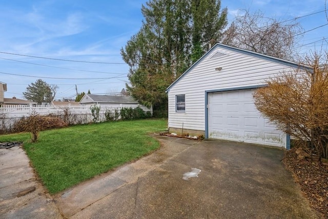 garage featuring a lawn