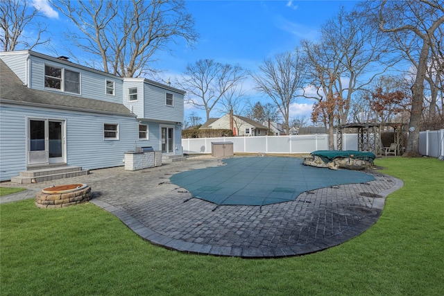 view of swimming pool featuring a yard and a patio area