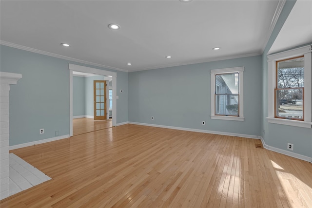 unfurnished living room with light hardwood / wood-style flooring, ornamental molding, and french doors