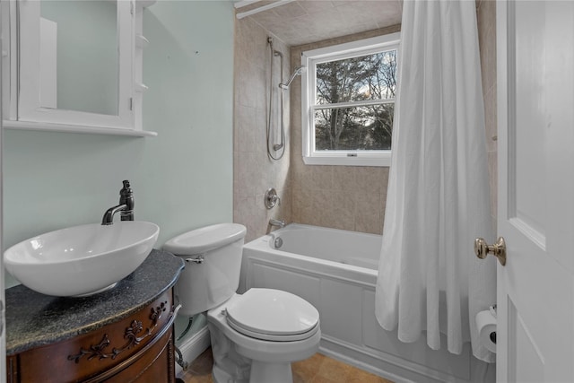 full bathroom featuring vanity, toilet, and shower / tub combo