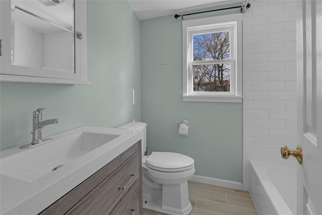 full bathroom with vanity, tiled shower / bath, tile patterned floors, and toilet