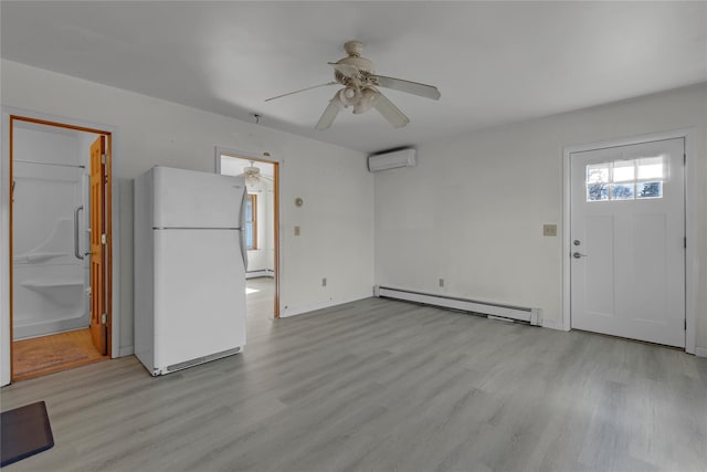 unfurnished living room featuring ceiling fan, a wall mounted air conditioner, light hardwood / wood-style flooring, and a baseboard heating unit