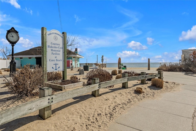 surrounding community featuring a water view