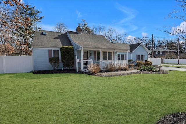 single story home featuring covered porch and a front lawn