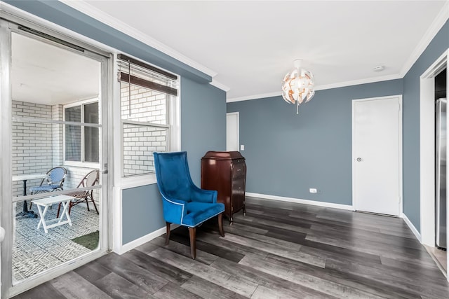 living area with crown molding, dark wood-type flooring, and a notable chandelier