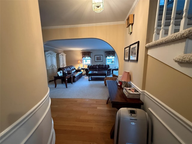 interior space with hardwood / wood-style flooring and ornamental molding