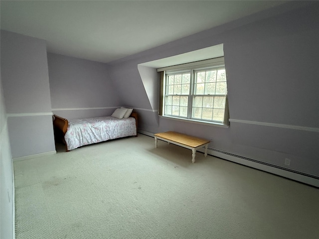 unfurnished bedroom featuring carpet floors and baseboard heating