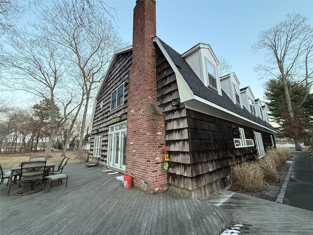 view of home's exterior featuring a deck