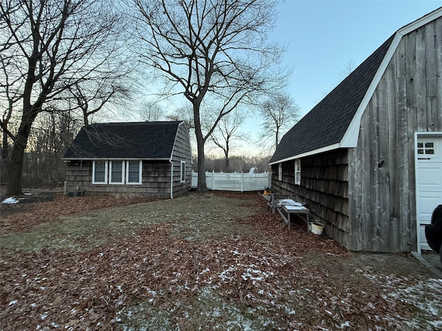 view of home's exterior featuring an outdoor structure