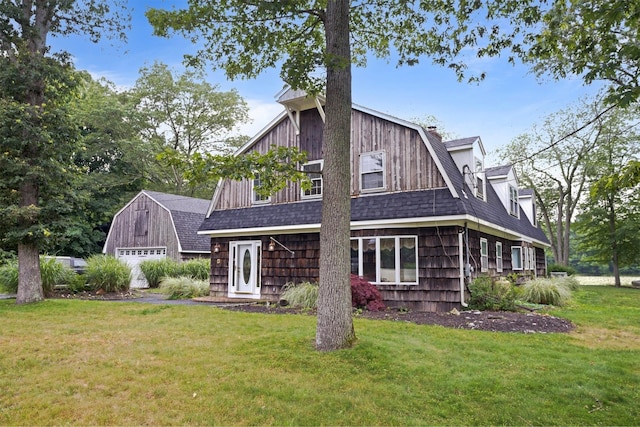 1 Lake Dr, Middle Island, NY 11953 - back of house featuring a gambrel roof, a lawn, an outdoor structure, and roof with shingles