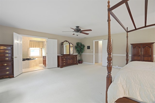 1 Lake Dr, Middle Island, NY 11953 - bedroom with light carpet, connected bathroom, and a ceiling fan