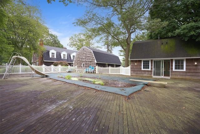 1 Lake Dr, Middle Island, NY 11953 - view of pool featuring a water slide, a deck, and a fenced backyard