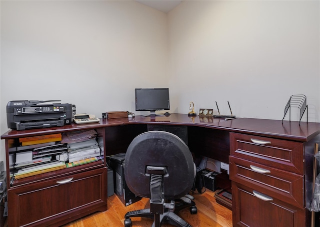 office with light wood-type flooring