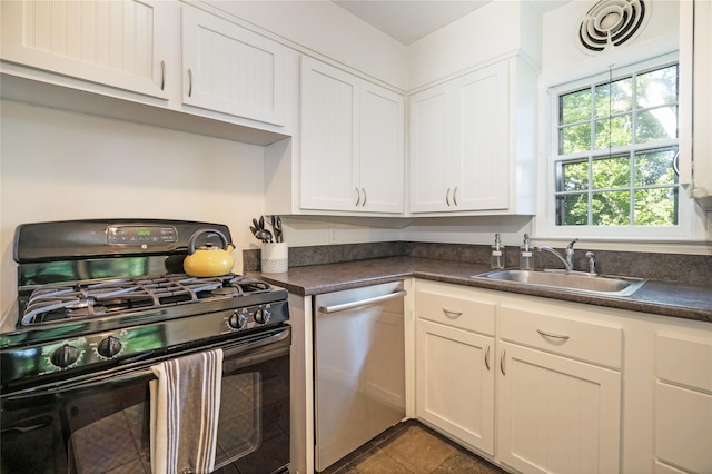 kitchen with stainless steel dishwasher, black gas stove, sink, and white cabinets