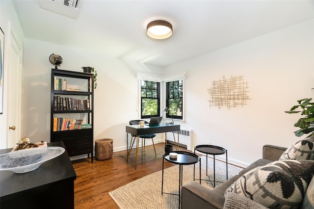 interior space with radiator and dark wood-type flooring