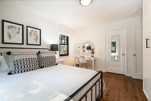 bedroom featuring dark wood-type flooring