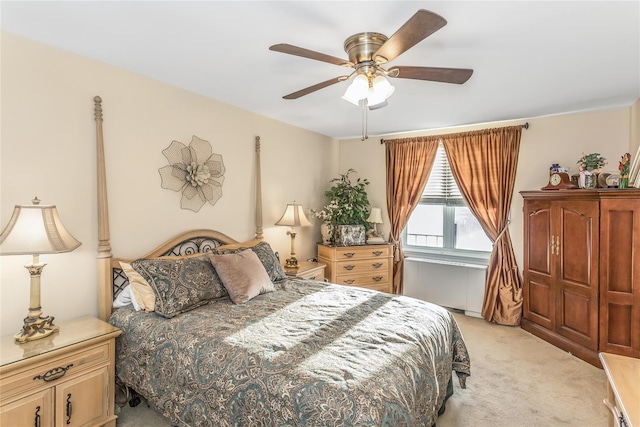 bedroom with light carpet and ceiling fan