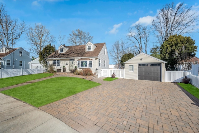 cape cod-style house with a garage, an outdoor structure, and a front yard