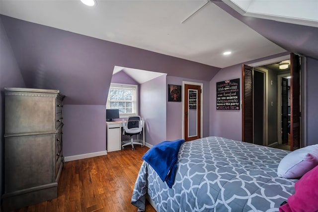 bedroom featuring dark hardwood / wood-style floors and vaulted ceiling