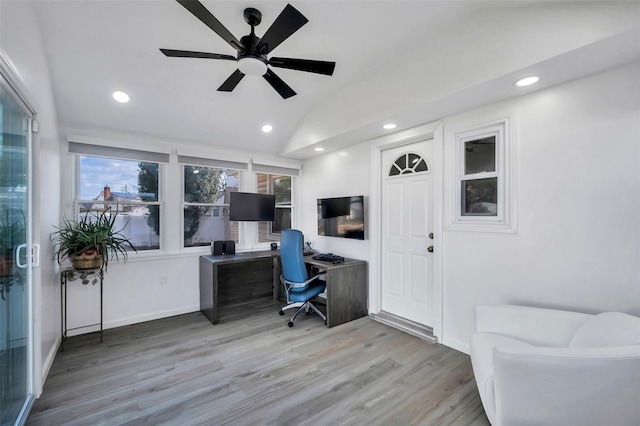 office area with ceiling fan, lofted ceiling, a healthy amount of sunlight, and light hardwood / wood-style floors