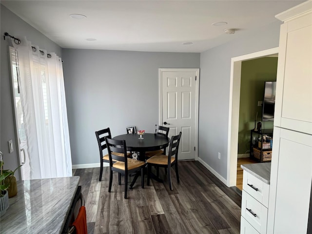 dining area featuring dark hardwood / wood-style floors