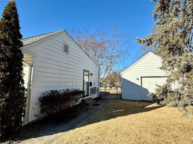 view of property exterior featuring an outbuilding and a garage