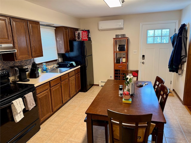 kitchen featuring an AC wall unit, sink, backsplash, a baseboard heating unit, and black electric range