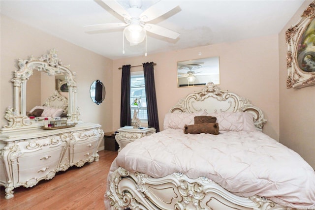 bedroom featuring wood-type flooring and ceiling fan