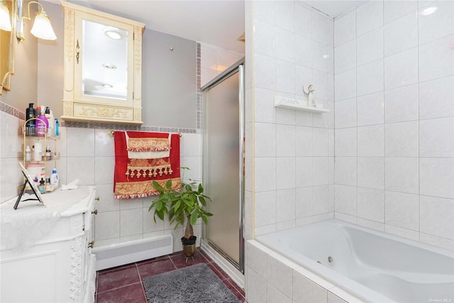 bathroom featuring tile walls, vanity, tile patterned floors, and independent shower and bath