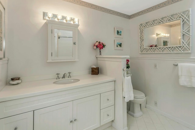 bathroom featuring vanity, tile patterned floors, and toilet